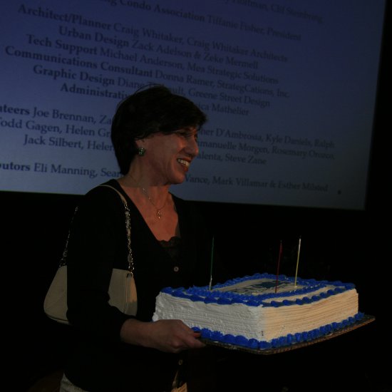 Ines Garcia Keim bringing in the 25th Anniversary cake.