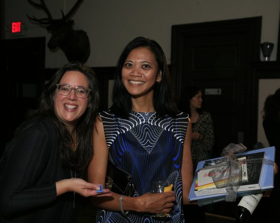 Kate Valenta and her friend with her bucket raffle prize.